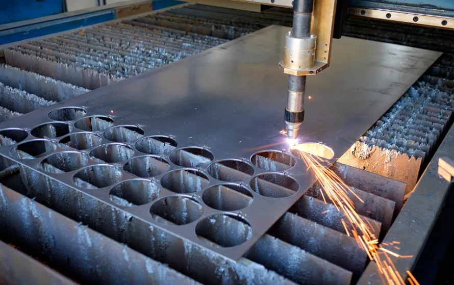 CNC plasma cutter slicing circular blanks from a steel plate